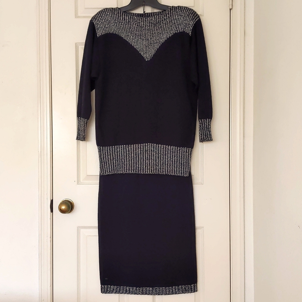 Woman's sweater top and skirt set with sparkling shoulders and trim.